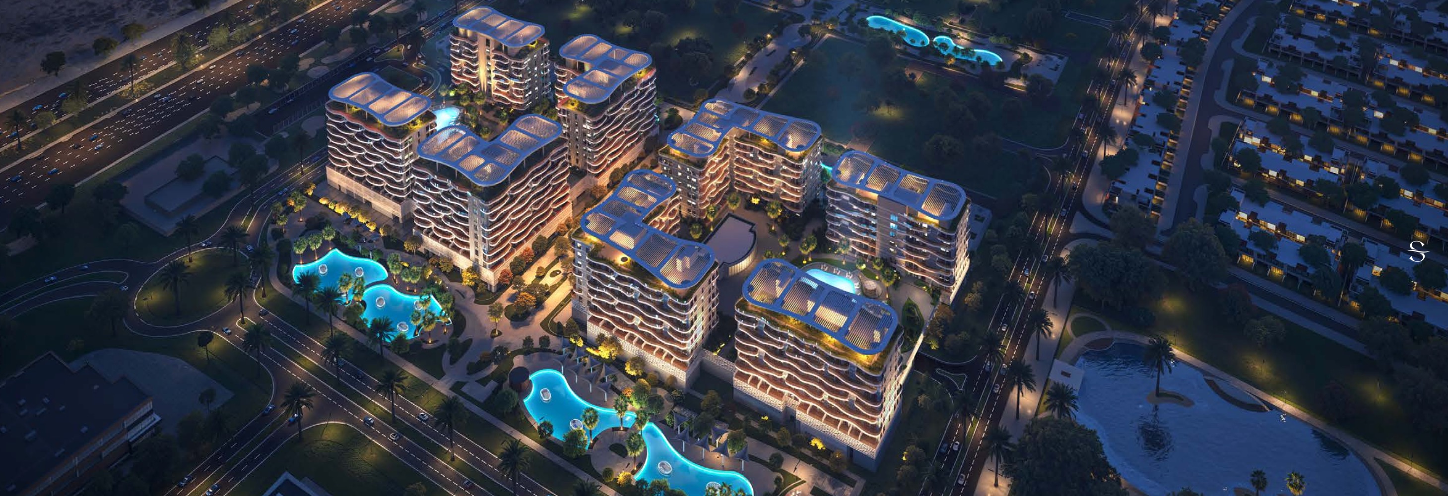 Aerial night view of Sorrento's towers around glowing lagoon pools